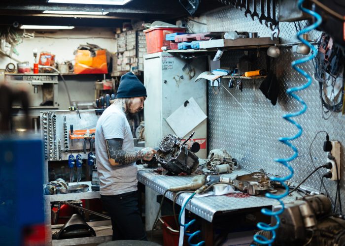 Modern repairman working in garage